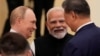 Премьер Индии Нарендра Моди, глава КНР Си Цзиньпин и Владимир Путин встречаются на полях саммита ШОС в Тяньцзине, Китай, 1 сентября 2025 года