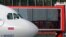 Cuba -- Passengers disembark from Aeroflot's Moscow-Havana flight, an Airbus A330-243, at Havana's Jose Marti International Airport July 11, 2013. 