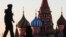 RUSSIA -- Police officers patrols on deserted Red Square after the city authorities announced a lockdown ordering residents to stay at home to prevent the spread of coronavirus disease, in central Moscow, April 6, 2020