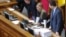 UKRAINE -- Yulia Tymoshenko (2-R), Leader of Batkivshchyna (Motherland) party, occupies the speaker's place as Ukrainian lawmakers clash as part of them try to block the podium during a hearing for opening a land market, at the Parliament in Kyiv, Februar
