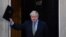 U.K. -- Britain's Prime Minister Boris Johnson waves as he returns to 10 Downing Street in central London on December 13, 2019, after delivering a speech following his Conservative party's general election victory.