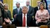 U.S. -- U.S. President Donald Trump talks to reporters as he participates in a bill signing ceremony for the “Trafficking Victims Protection Reauthorization Act” with (L-R) Department of Homeland Security Secretary Kirstjen Nielsen, Secretary of Health an