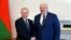 RUSSIA -- ST PETERSBURG, JULY 13, 2021: Russian President Vladimir Putin (Left) and Belarusian President Alyaksandr Lukashenka shake hands during a meeting. 