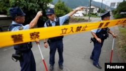 Japan - Police officers investigate near a facility for the disabled, where a deadly attack by a knife-wielding man took place, in Sagamihara, Kanagawa prefecture, Japan, July 26, 2016.