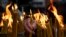 NORTH MACEDONIA - An Orthodox believer lights candles during a Christmas mass outside the central Orthodox Church of Saint Clement in Skopje, Republic of North Macedonia, 07 January 2021