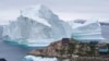 DENMARK -- An iceberg is stranded near the village of Innaarsuit, in the Avannaata Municipality, northwestern Greenland, July 12, 2018