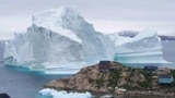 DENMARK -- An iceberg is stranded near the village of Innaarsuit, in the Avannaata Municipality, northwestern Greenland, July 12, 2018