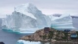 DENMARK -- An iceberg is stranded near the village of Innaarsuit, in the Avannaata Municipality, northwestern Greenland, July 12, 2018