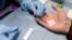 RUSSIA -0-  A man has a blood test at a mobile HIV testing unit in Yekaterinburg, November 2, 2016