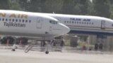 Tajikistan -- Tajik Air company airplanes, Dushanbe international airport, undated