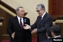 Nursultan Nazarbaev (left) chose Qasym-Zhomart Toqaev to succeed him as president in 2019.