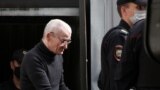 Russia -- Russian historian Yuri Dmitriev is escorted by police officers after a court hearing in Petrozavodsk
