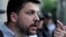Russia -- Leonid Volkov, head of the office of the unregistered opposition party PARNAS, speaks outside the building of the Novosibirsk region election commission, Novosibirsk, July 28, 2015