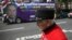U.K. - A Chelsea Pensioner passes in front of the UK Independence Party (UKIP) pro-brexit campaign bus, parked in front of the Chelsea Flower Show in London, Britain May 28, 2016.
