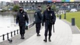 RUSSIA -- Russian police officers wearing face masks to protect against coronavirus patrol an area of the Ostankino Pond in Moscow, May 20, 2020