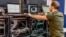 A man works next to servers specialised in cyber security  