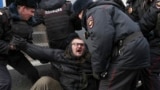 RUSSIA -- Police officers detain a demonstrator after the Free Internet rally in response to a bill making its way through parliament calling for all internet traffic to be routed through servers in Russia, in Moscow, March 10, 2019
