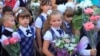 KALININGRAD, RUSSIA - SEPTEMBER 1, 2015: Girls first graders on a solemn ruler on September 1 in the city of Kaliningrad, Russia 