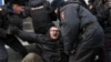 RUSSIA -- Police officers detain a demonstrator after the Free Internet rally in response to a bill making its way through parliament calling for all internet traffic to be routed through servers in Russia, in Moscow, March 10, 2019