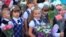 KALININGRAD, RUSSIA - SEPTEMBER 1, 2015: Girls first graders on a solemn ruler on September 1 in the city of Kaliningrad, Russia 
