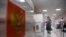 RUSSIA -- A woman wearing a face mask and gloves casts her early vote in a nationwide ballot on constitutional reforms at a polling station in Moscow on June 28, 2020.