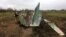 UKRAINE – Ukrainian military sapper inspects remains of a Russian Sukhoi Su-25 fighting aircraft hit by Ukrainian Armed Forces during Russia's invasion in Kyiv region, Ukraine April 21, 2022