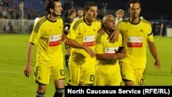 Russia -- Roberto Carlos of Anzhi Marhachkala (2L) is comforted by teammates during a game in Samara, 22Jun2012