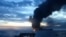 This video grab taken from images released by the Security service of Ukraine (SBU) on November 29, 2025, shows smoke rising from a cargo ship on fire in the Black Sea off the Turkish coast, amid the ongoing Russian-Ukrainian conflict.