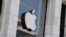 (FILES) The Apple logo is seen at the entrance of an Apple store in Washington, DC, on September 14, 2021.