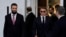 France's President Emmanuel Macron (R) and Syria's President  Ahmed al-Sharaa arrive to take part in the Economic forum focusing on the reconstruction of Syria and strategic corridors, in Damascus on July 7, 2026.