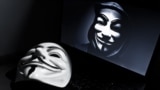 Vendetta mask on computeur with an anonymous member on screen