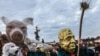 Czech Repoblic -- People wear masks as they march across the medieval Charles Bridge to commemorate the 27th anniversary of 1989 Velvet Revolution in Prague, November 17, 2016