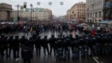 Saint Petersburg, Russia - Law enforcement officers block a road as protesters march along the Nevsky Avenue during a rally in support of jailed Russian opposition leader Alexei Navalny
