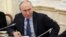 Russian President Vladimir Putin meets with war correspondents in Moscow