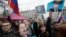 RUSSIA – Demonstrators carry posters depicting Russian President Vladimir Putin during a massive protest rally in St.Petersburg, May 5, 2018
