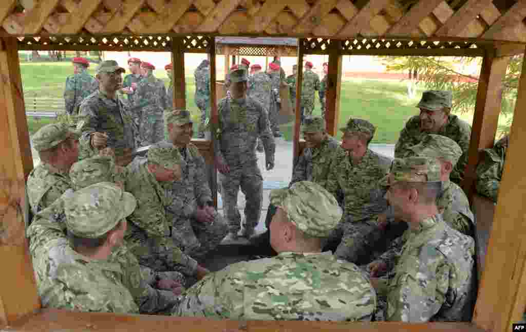 Ukraine -- Georgian servicemen rest during a break after an opening ceremony of the "Rapid Trident" military exercises on September 15, 2014 nearthe western Ukrainian town of Yavoriv