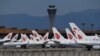 China -- Air China planes are seen parked on the tarmac at Beijing Capital Airport on March 27, 2020
