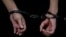 A person in handcuffs at Moscow's Basmanny District Court