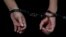 A person in handcuffs at Moscow's Basmanny District Court