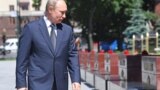 Russia's President Vladimir Putin takes part in a flower laying ceremony in Alexander Garden on Day of Memory and Sorrow