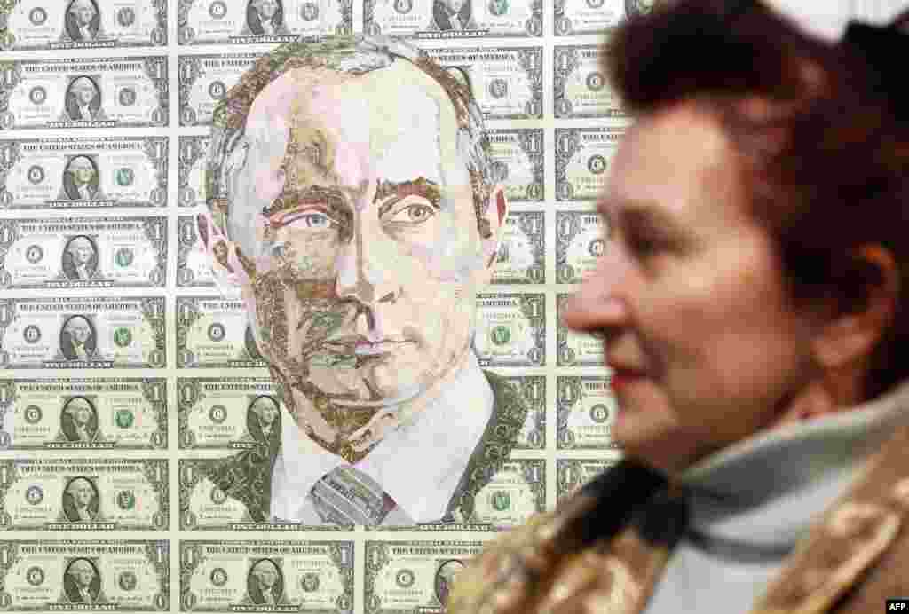 Портрет из долларов, сделанный в 2011 году под названием &quot;Зима&quot; украинским художником Русланом Кутняком