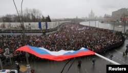 Holding placards declaring "I am not afraid," thousands of Russians marched in Moscow on March 1, 2015 to protest the assassination of Boris Nemtsov.