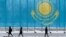 KAZAKHSTAN -- People walk past a gaint Kazakhstan's flag in Astana, March 5, 2019