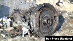 One of the engines of Ukraine International Airlines flight 752, a Boeing 737-800 plane that crashed after taking off from Tehran's Imam Khomeini airport on January 8, 2020, is seen in this still image taken from Iran Press footage. 