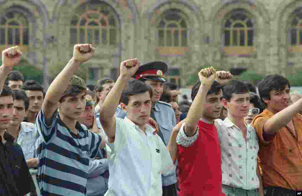 Young men raise clenched fists during a Yerevan rally on September 21, 1991, as citizens vote in a referendum on whether to leave the Soviet Union.&nbsp; Officially, 99 percent of participating voters chose independence for Armenia.&nbsp;