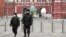 RUSSIA -- Russian police officers patrol the deserted Red Square in Moscow, March 30, 2020
