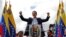 Juan Guaido, President of Venezuela's National Assembly, reacts during a rally against Maduro
