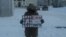 Nikita Tushkanov, village teacher from Komi, with a poster "Be quiet or die"