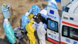 CHINA -- Medical staff transfer patients to the newly completed Huoshenshan temporary field Hospital in Wuhan, Hubei Province, February 4, 2020