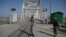 AFGHANISTAN -- Afghan border police personnel stand guard on the Afghan side of the Afghanistan–Uzbekistan bridge in Hairatan, March 20, 2016